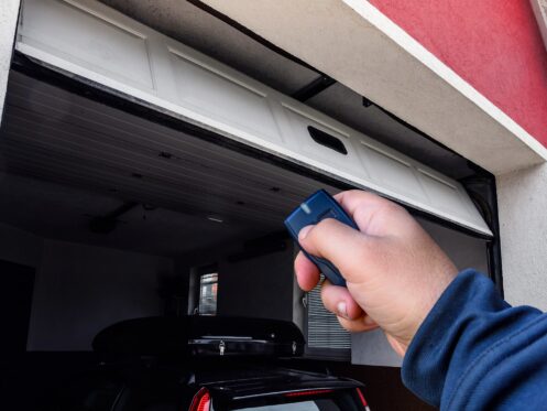 Hand use remote controller for closing and opening garage door